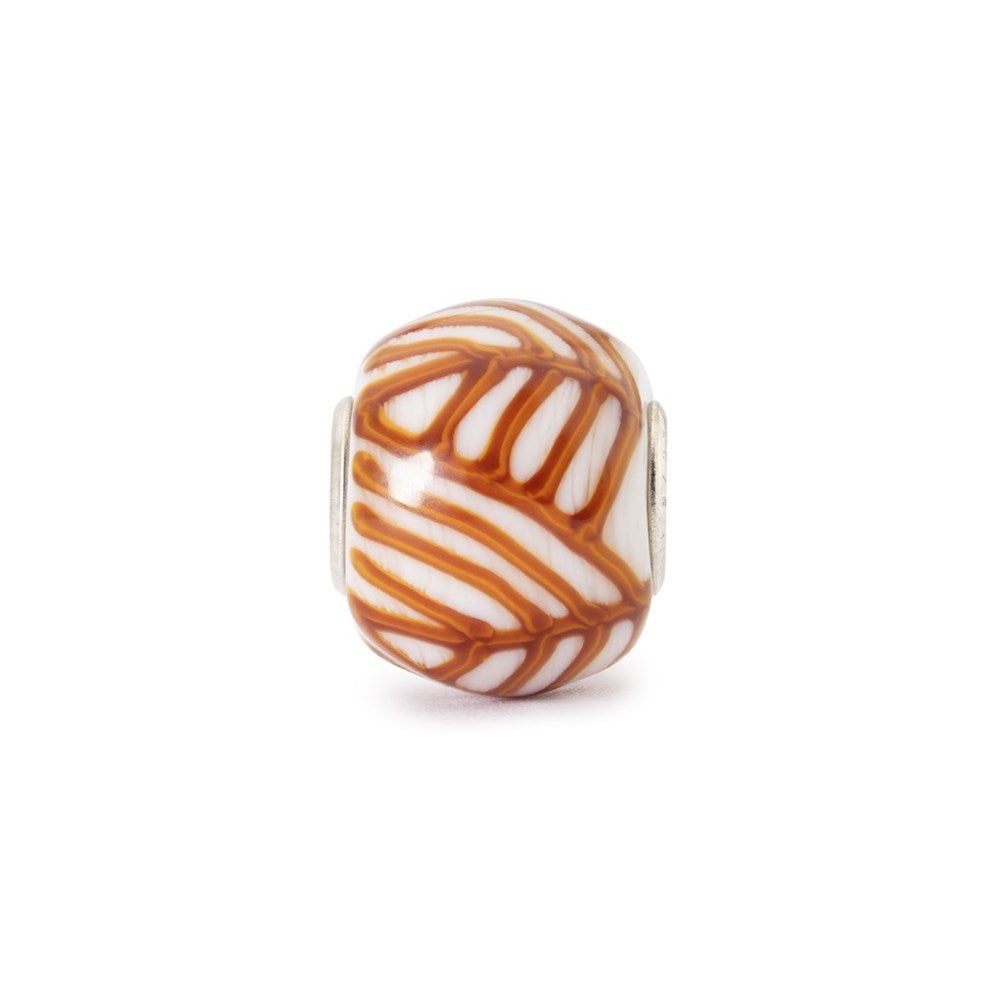 Decorative bead with brown and white pattern on a white background