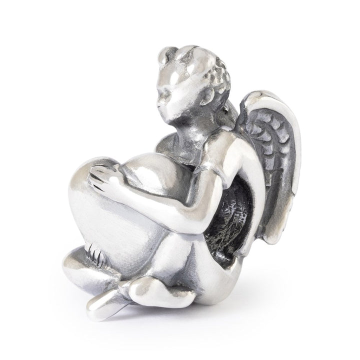 Silver angel figurine on a white background