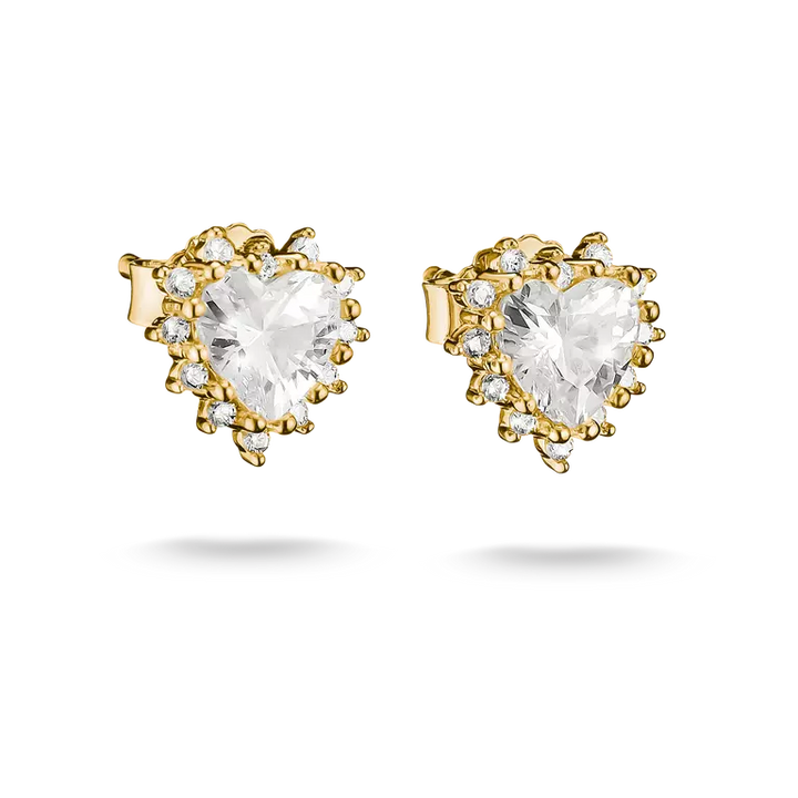 A pair of gold heart-shaped stud earrings with clear heart-cut center stones and small clear accent stones, shown on a white background.
