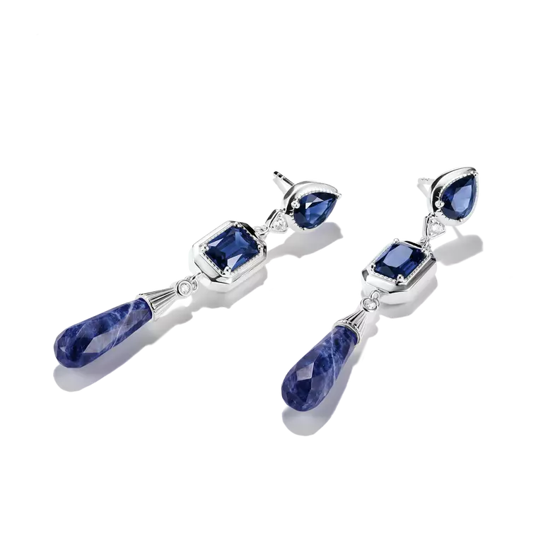 A pair of silver drop earrings featuring deep blue gemstone clusters, including teardrop, rectangular, and marquise-cut stones, shown against a plain white background.