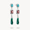 Pair of earrings with gemstones on a white background