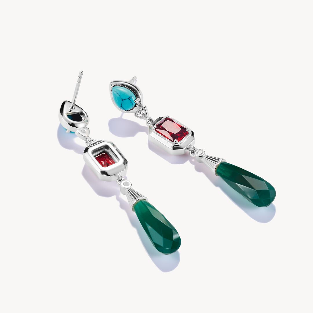 Colorful gemstone earrings on a white background