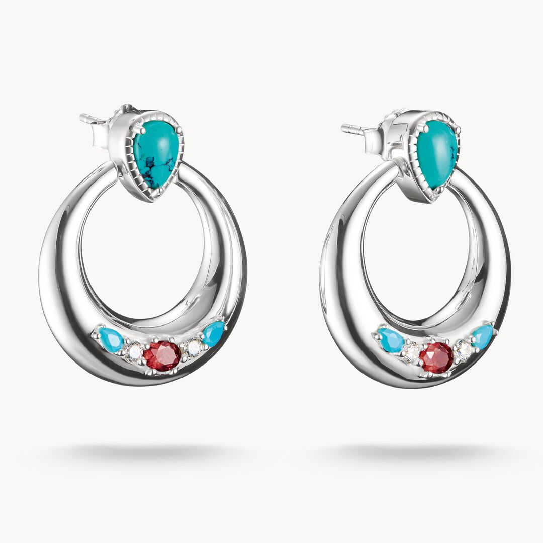 Silver hoop earrings with turquoise and red gemstones on a white background