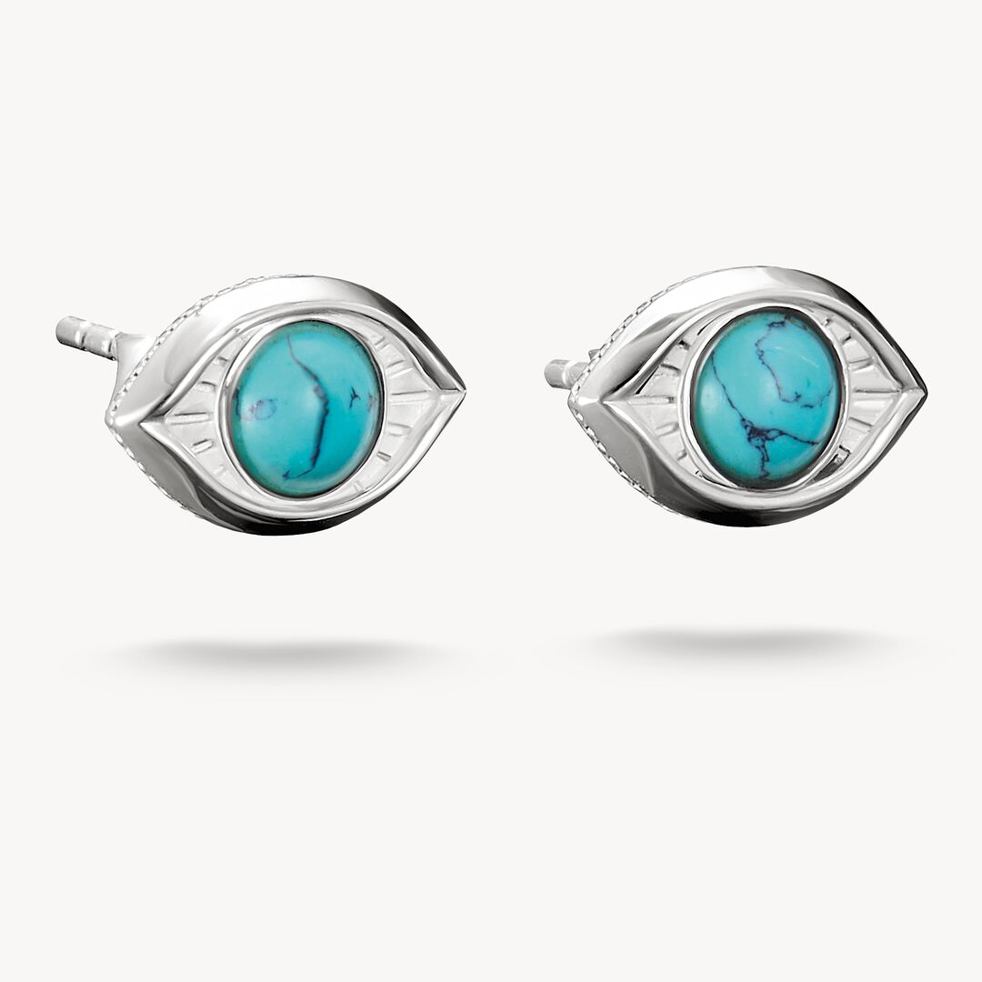 Pair of silver earrings with turquoise stones on a white background