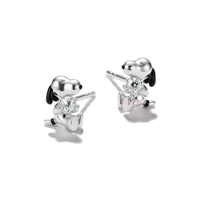 Silver dog-shaped earrings with clear gemstones on a white background
