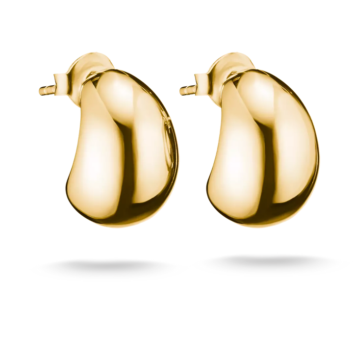 A pair of polished yellow gold hoop earrings with a smooth, rounded, bean-like organic shape, shown on a clean white background with a soft shadow underneath.