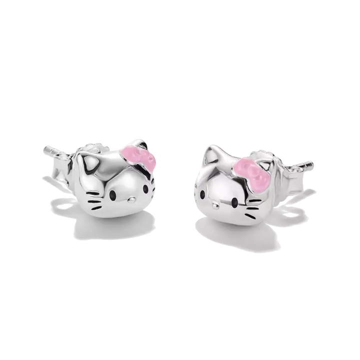 A pair of sterling silver stud earrings shaped like Hello Kitty's faces, featuring a small pink bow on each earring, set against a clean white background.