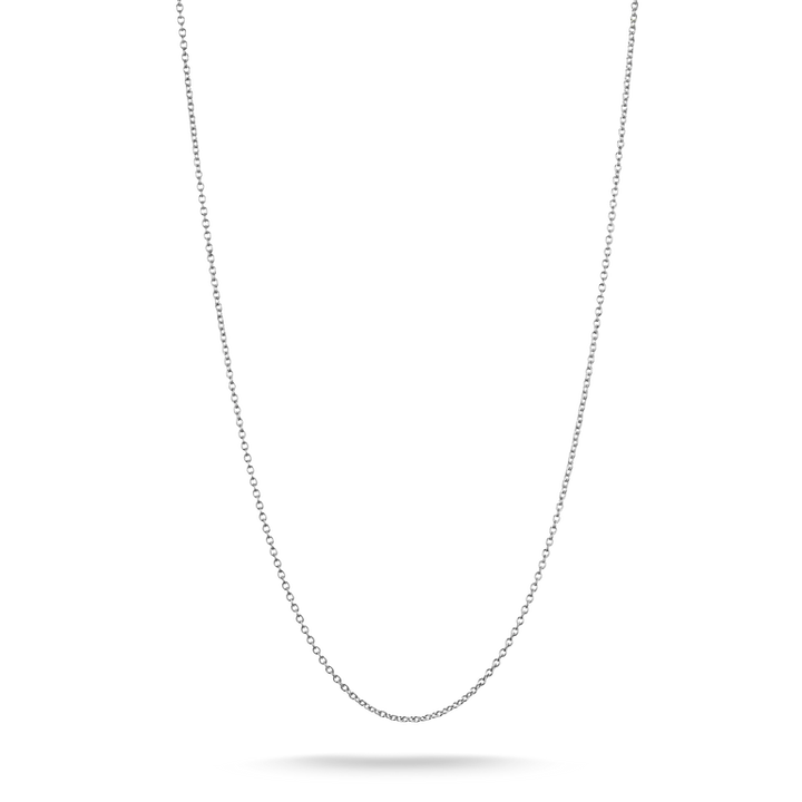 A delicate silver chain necklace shown against a plain white background, suspended in a U-shape with a soft shadow beneath the lowest point.
