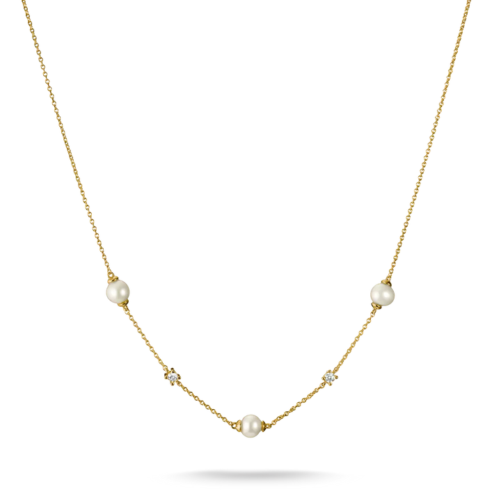 A delicate gold necklace featuring three white freshwater pearls and three small clear crystal clusters spaced along the chain, displayed on a clean white background.