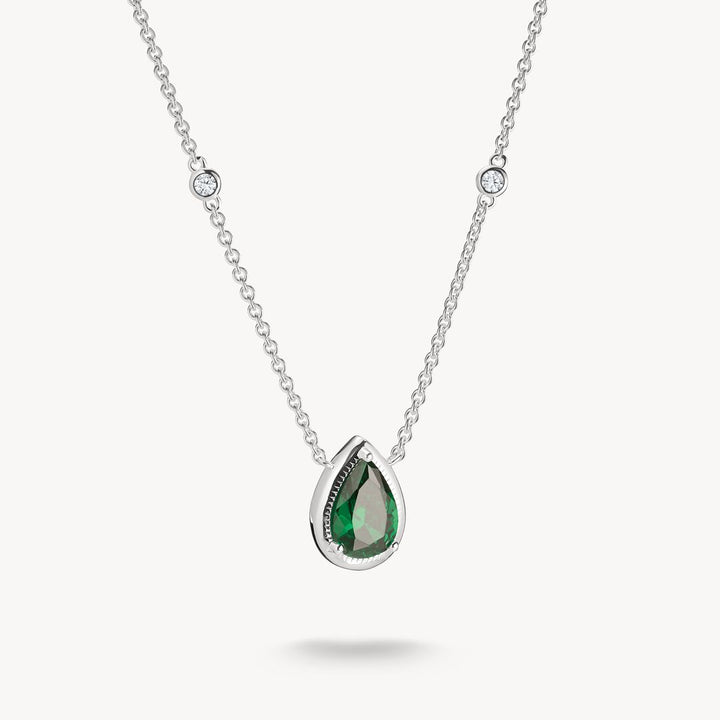 Silver necklace with a green teardrop pendant on a white background