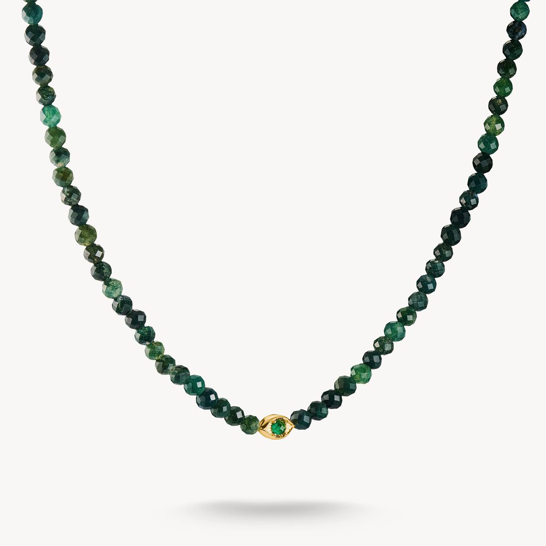 Green beaded necklace with a gold clasp on a white background