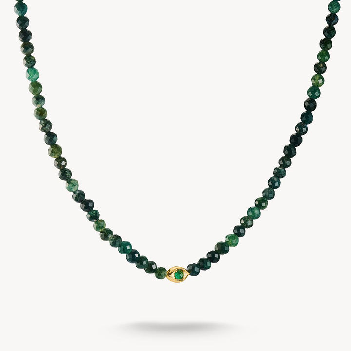 Green beaded necklace with a gold clasp on a white background