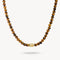 Beaded necklace with a gold clasp on a white background