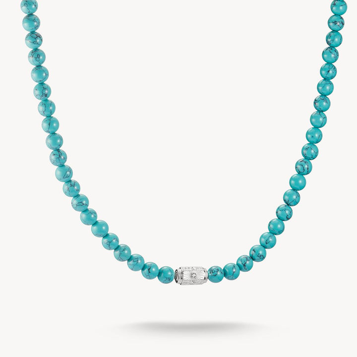Turquoise beaded necklace with a silver clasp on a white background