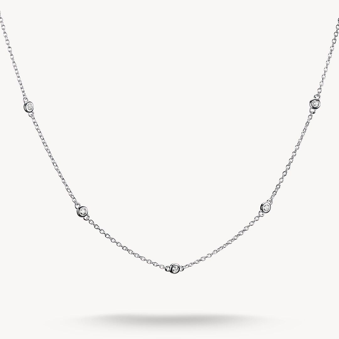 Silver necklace with small diamonds on a white background