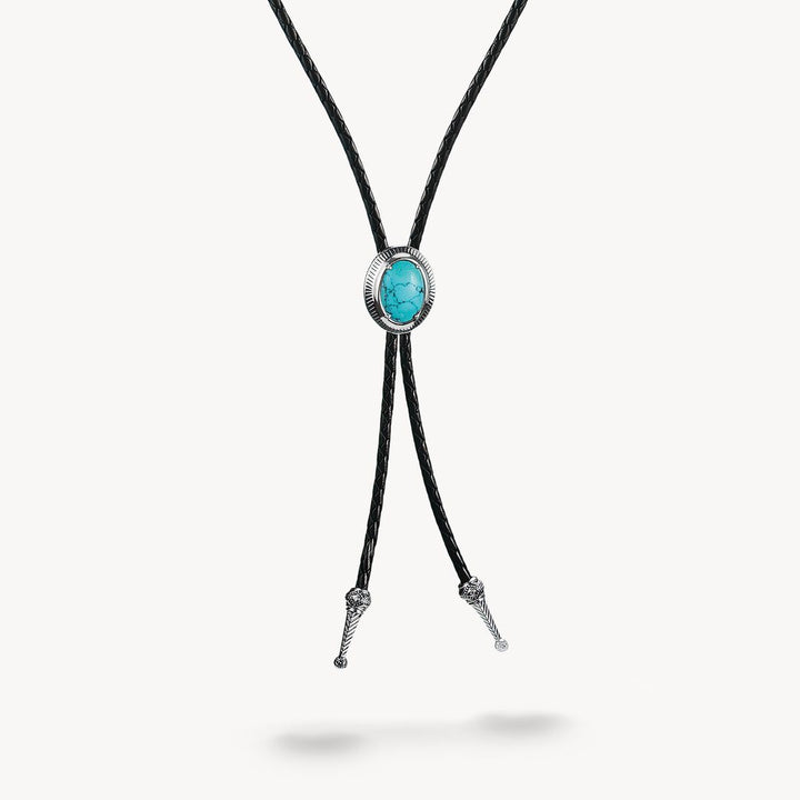 Bolo tie with turquoise stone and silver accents on a white background