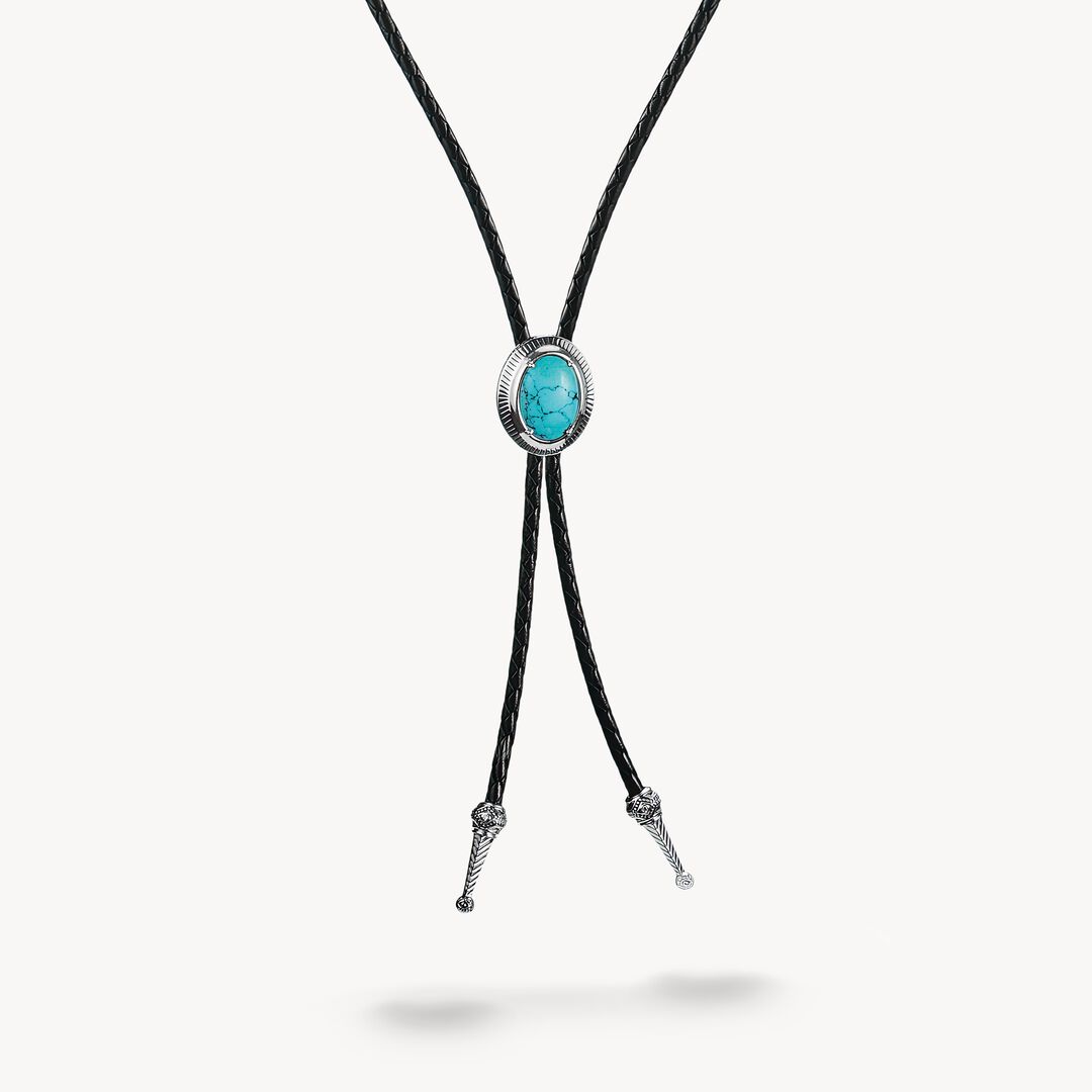 Bolo tie with turquoise stone and black cord on a white background