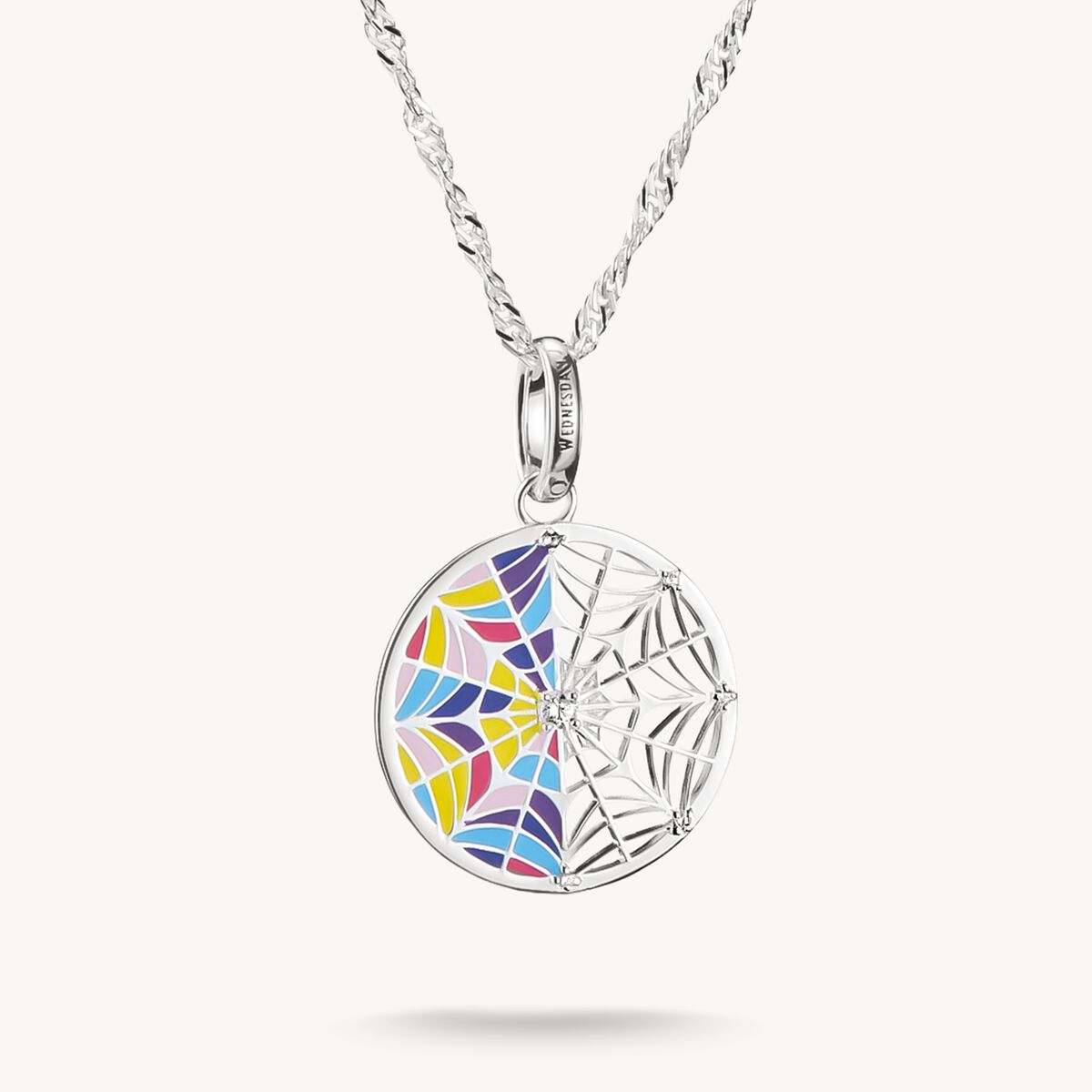 Colorful spider web pendant on a white background