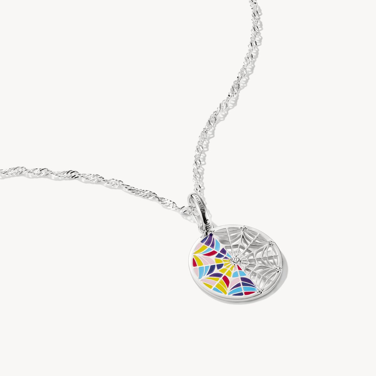 Colorful spider web pendant on a white background
