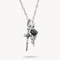 Silver necklace with a black rose and skeleton hand pendant on a white background
