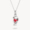Silver pendant shaped like a dog with a red heart on a white background