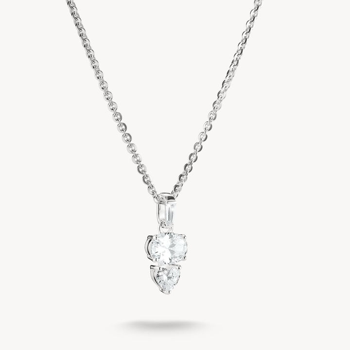 Diamond necklace with two heart-shaped pendants on a white background