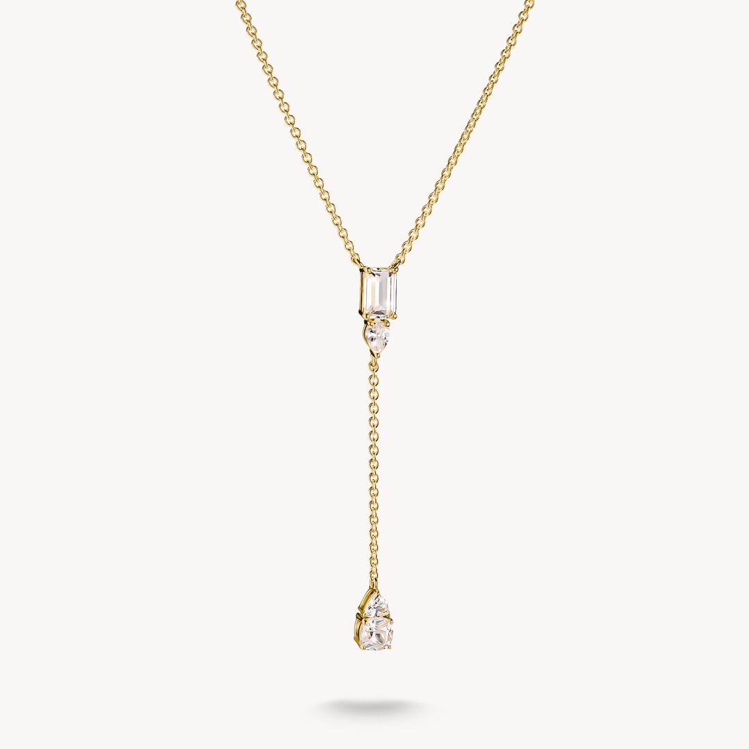 Gold necklace with a diamond pendant on a white background