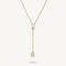 Gold necklace with a diamond pendant on a white background