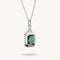 Silver pendant with green gemstone on a white background
