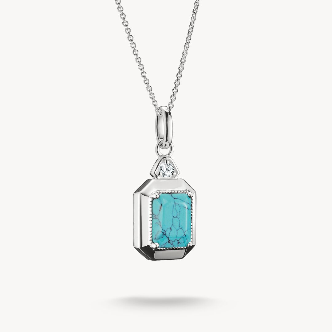 Turquoise pendant necklace on a white background