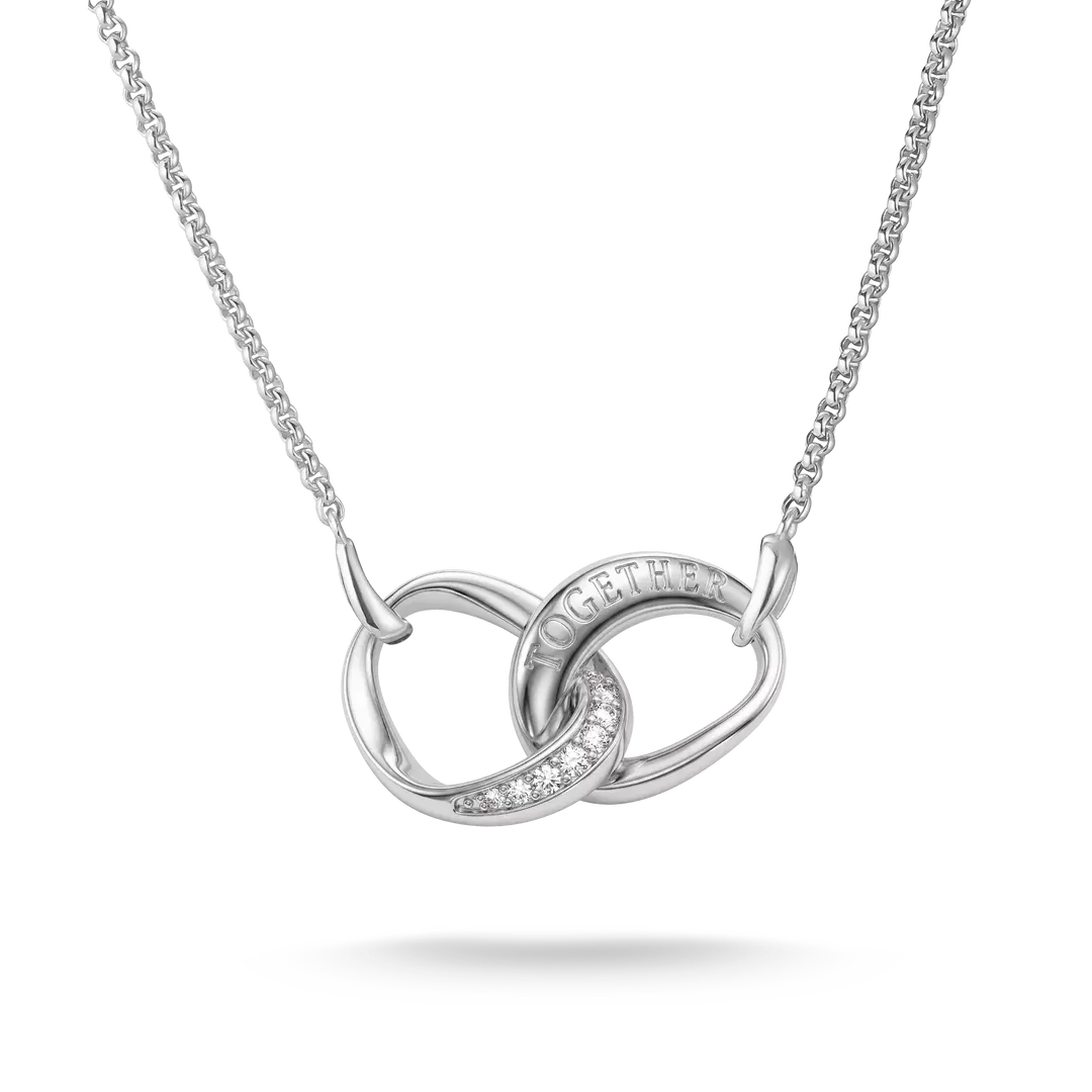 A silver interlocking knot necklace with a delicate chain, featuring a small pavé diamond accent and the word 'HOPE' engraved on one of the loops, set against a clean white background.