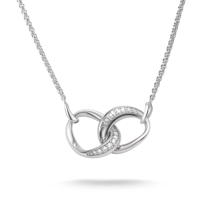 A silver interlocking knot necklace with a delicate chain, featuring a small pavé diamond accent and the word 'HOPE' engraved on one of the loops, set against a clean white background.