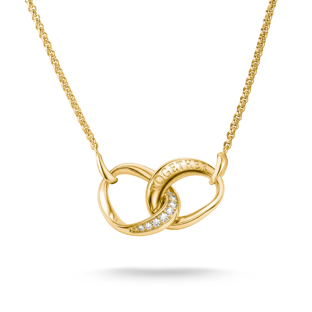 A gold necklace with an interlocking knot pendant, featuring a curved section paved with small clear stones and the word 'LOVE' engraved on the top loop, shown against a plain white background.