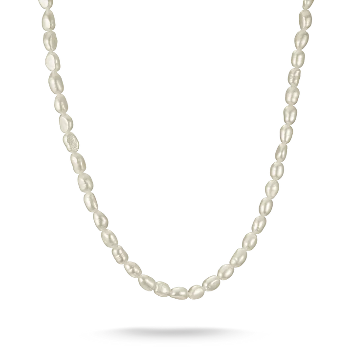 A delicate strand of irregular white baroque pearls draped in a U-shape against a clean white background.