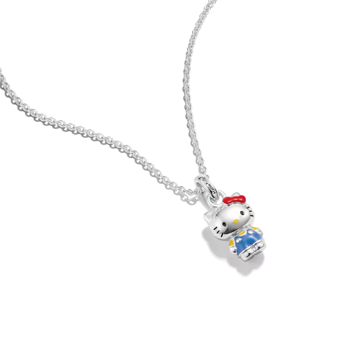 A silver chain necklace featuring a Hello Kitty pendant with white enamel, a red bow, and blue and yellow details, shown on a plain white background.