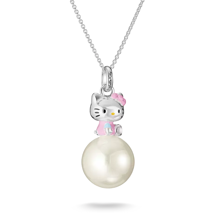 A silver pendant necklace featuring a Hello Kitty character sitting on a large white pearl, suspended from a delicate silver chain against a white background.