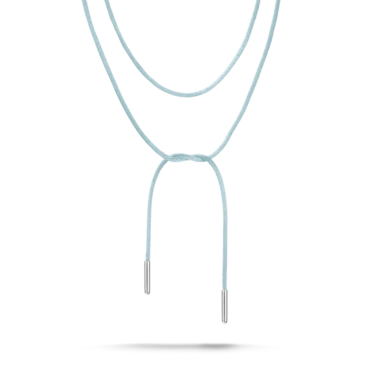 A double-layered cord necklace in a light pastel blue color, featuring silver metal tips at the ends of the hanging cords, shown against a plain white background.
