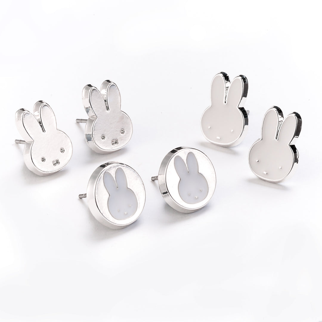 Set of silver bunny-shaped earrings on a white background