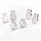 Set of silver bunny-shaped earrings on a white background