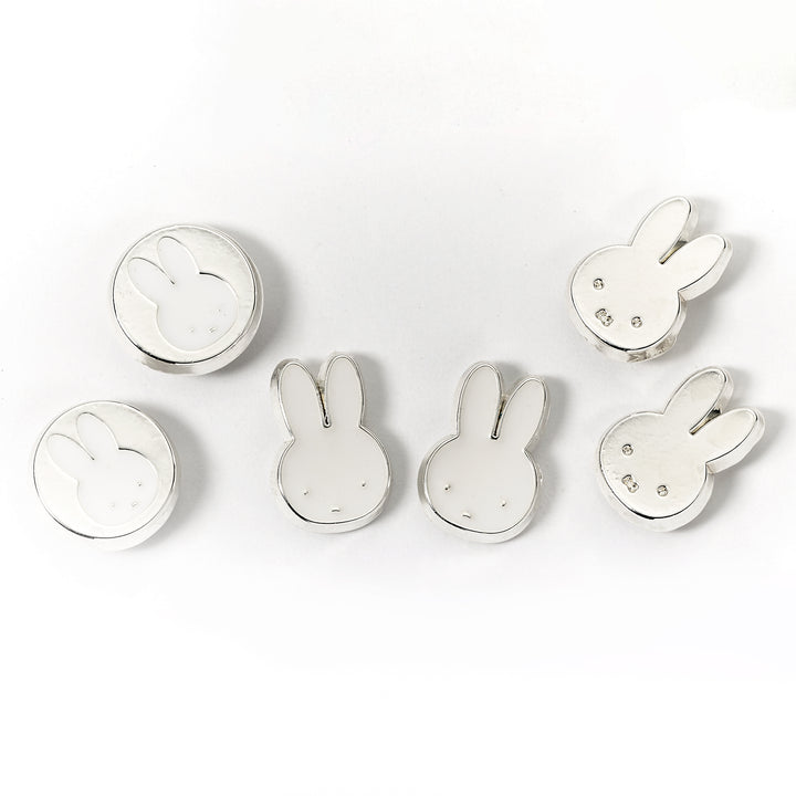 Set of silver rabbit-shaped earrings on a white background