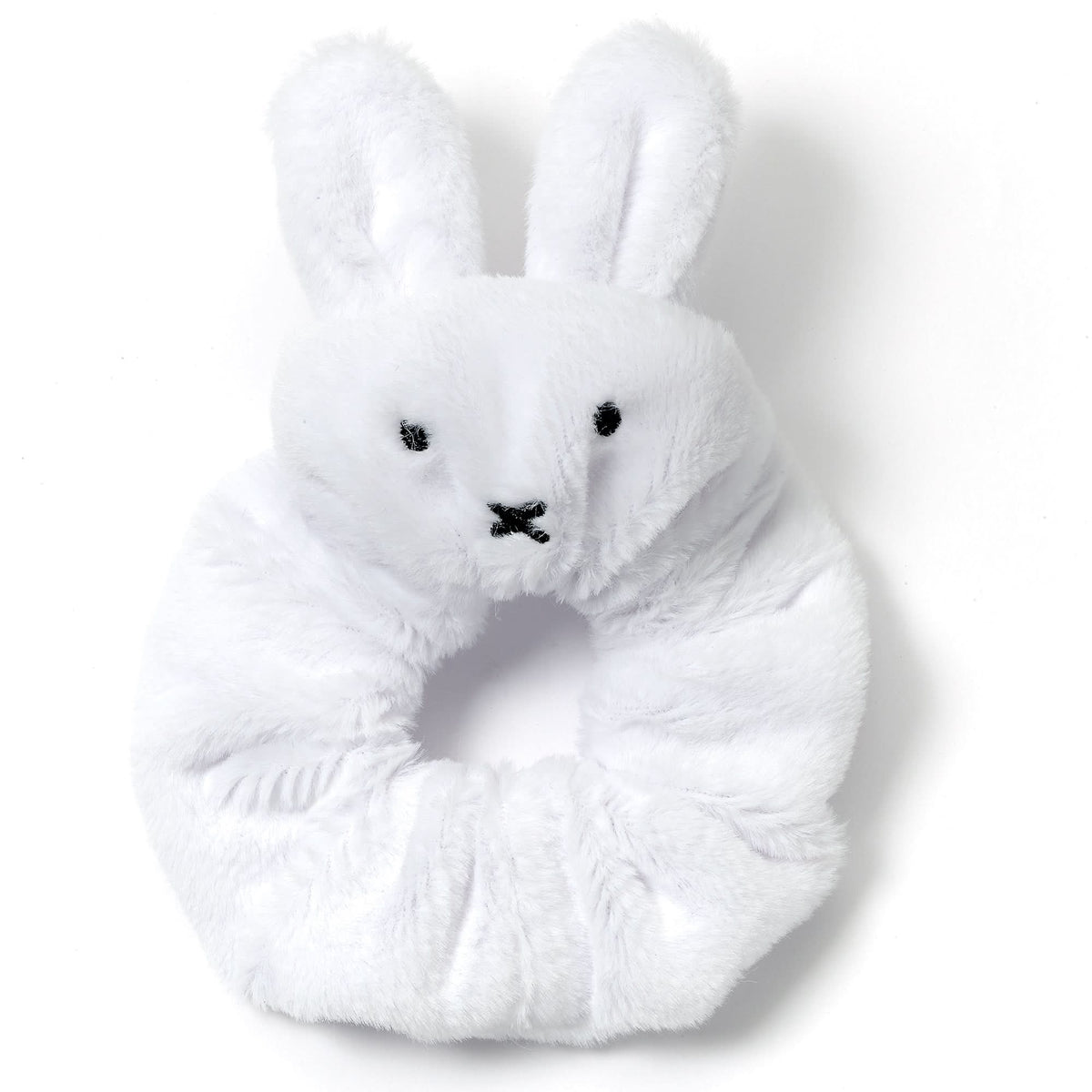 White plush bunny toy on a white background