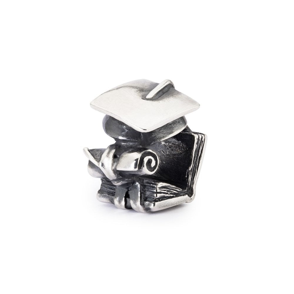 Silver graduation cap charm on a white background