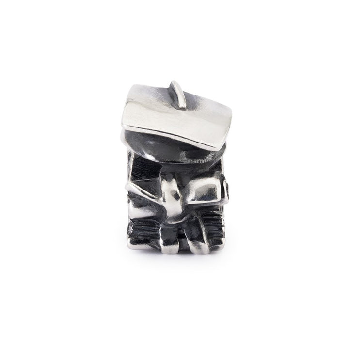 Silver robot charm on a white background