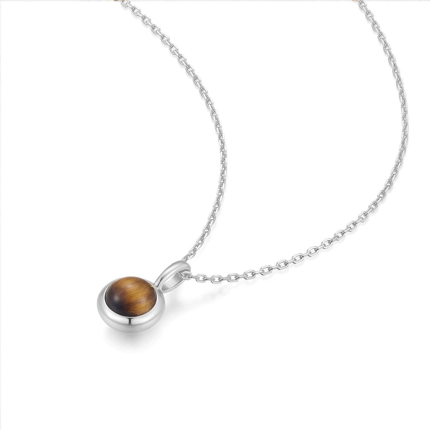 Silver necklace with a round pendant on a white background