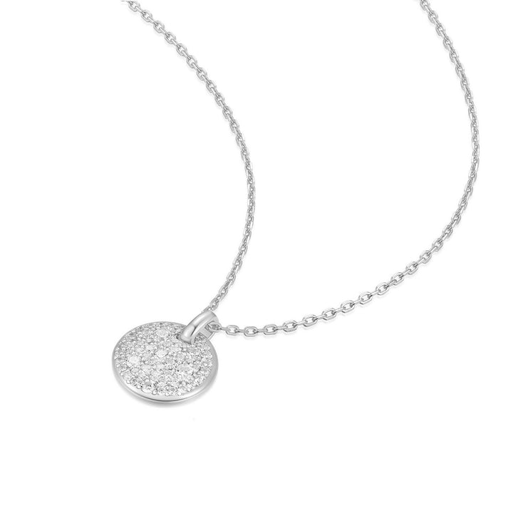 Silver necklace with a round, sparkling pendant on a white background
