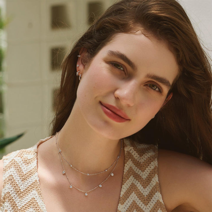 Woman wearing a necklace with a blurred background
