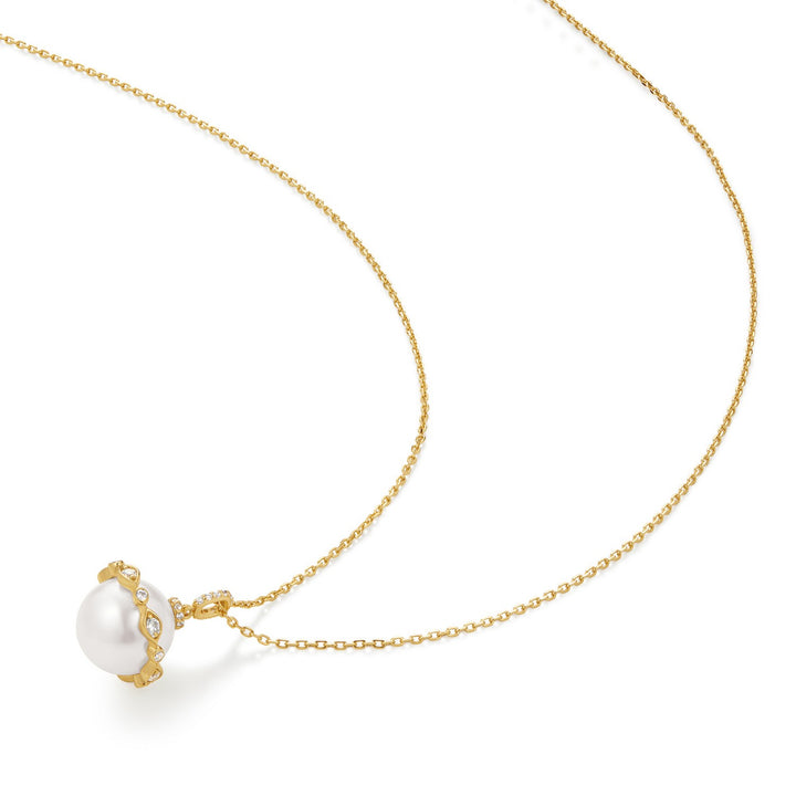 Gold necklace with a pearl pendant on a white background