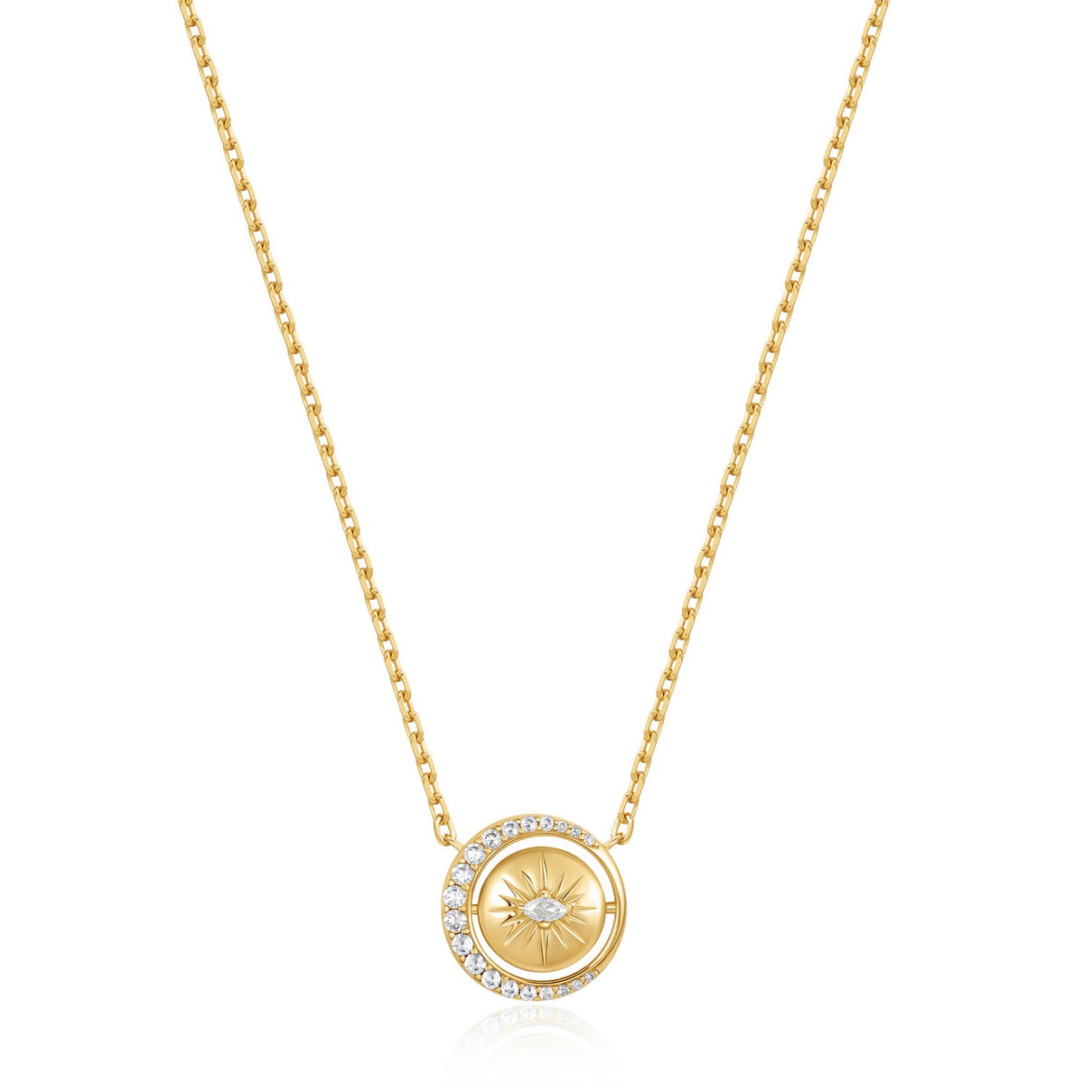 Gold necklace with a circular pendant on a white background