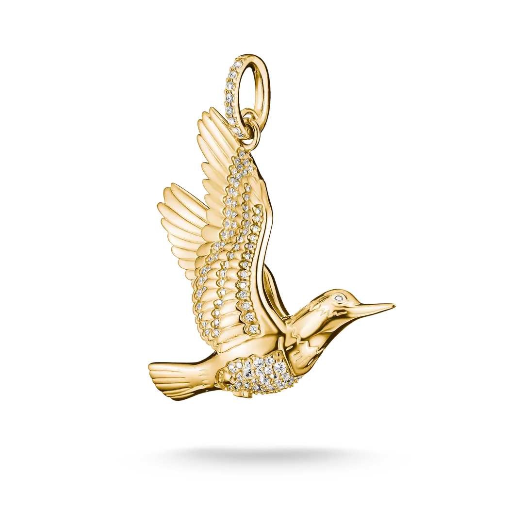 A gold bird pendant with wings spread, adorned with small clear stones, shown on a clean white background.