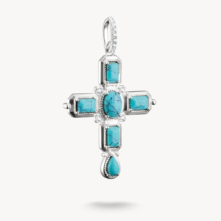 Silver cross pendant with turquoise stones on a white background